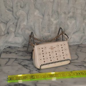Coach floral rivet wristlet with chain